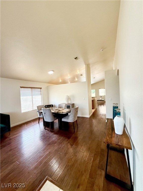 Dining space featuring visible vents, baseboards,