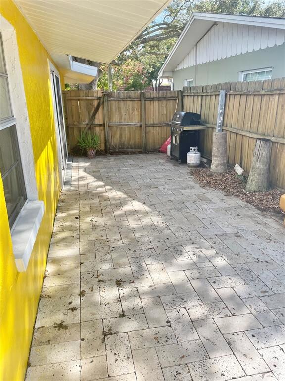 Travertine pavers over a large patio area of the s