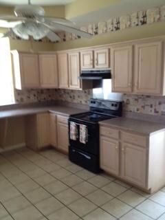 Right side of kitchen with new stove and hood