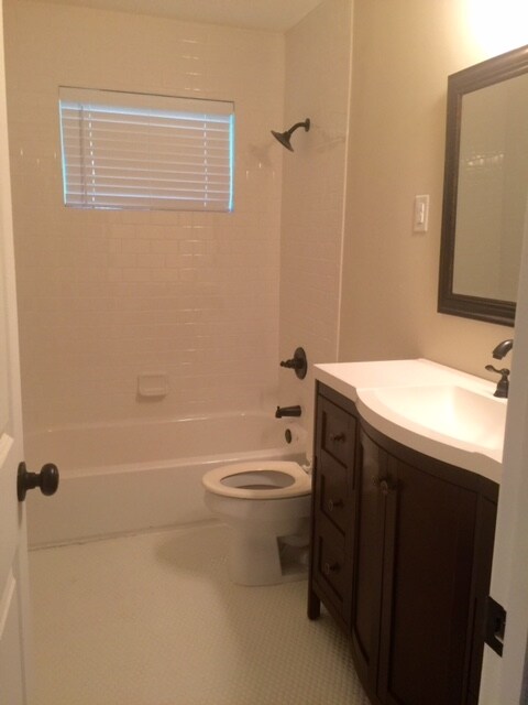 Hall Bath has been updated with ceramic tile and r