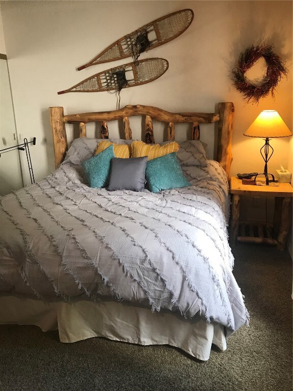 Bedroom featuring carpet floors