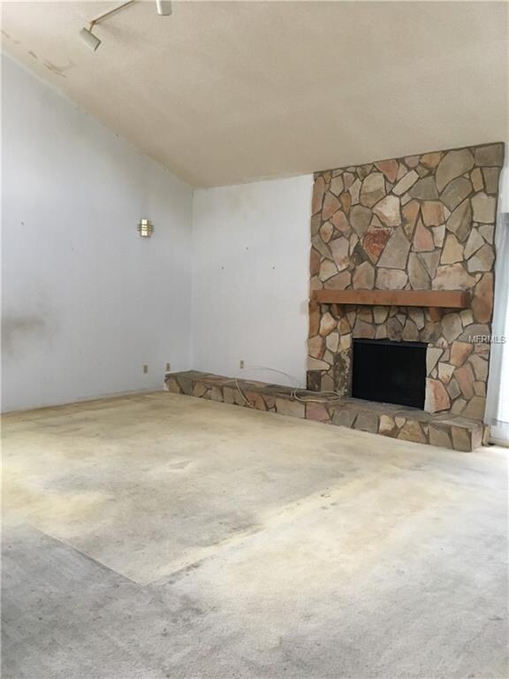 Wood burning fireplace in living room