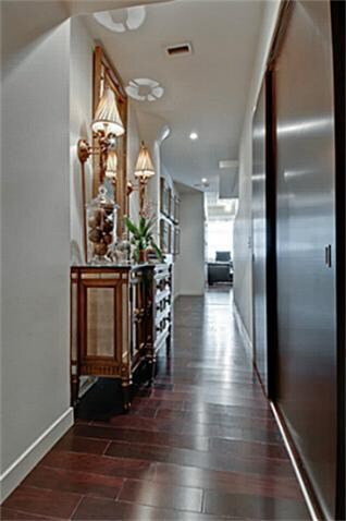 The entry hall of the condo is warm and welcoming 