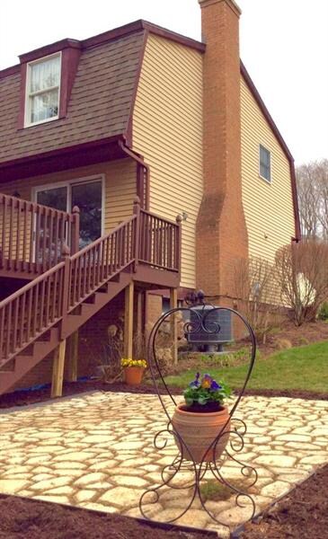 Lovely stone patio off the large rear deck