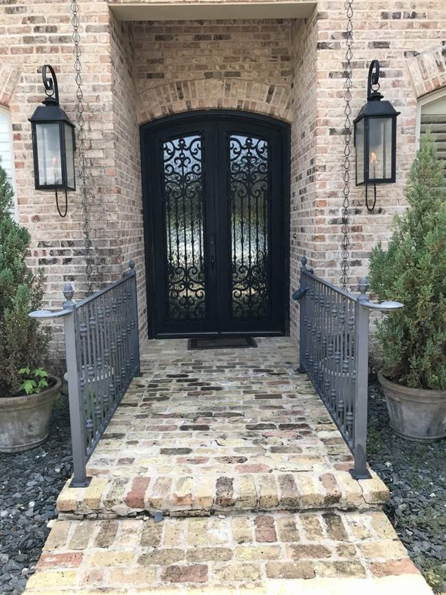 Pretty walkway wrought iron hand rails.