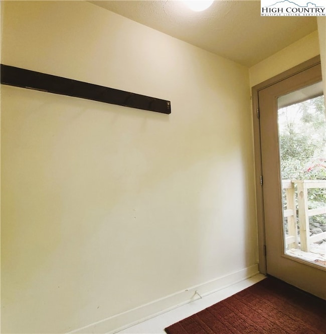 Landing at entry door with space to hang coats and
