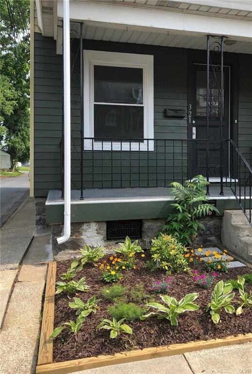 FRONT PORCH WITH NEW GARDEN