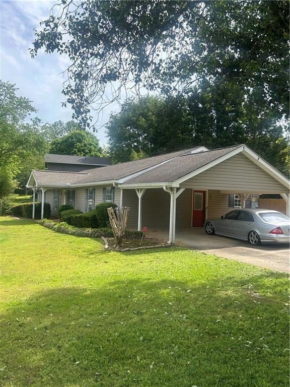 Ranch-style home with a carport, a front lawn, and