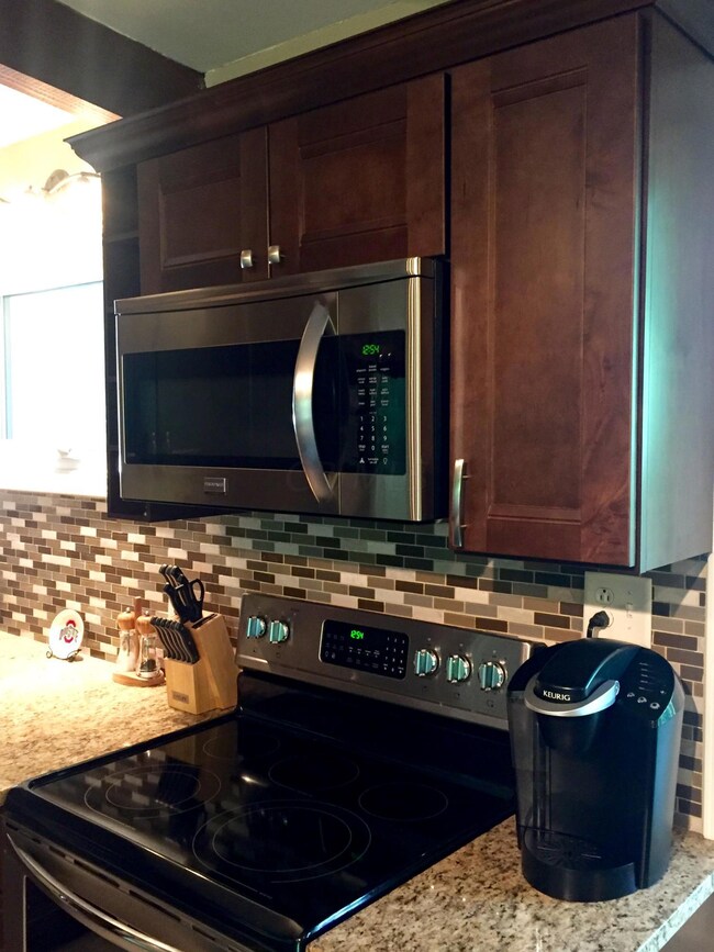 New Cabinets, Backsplash & Granite