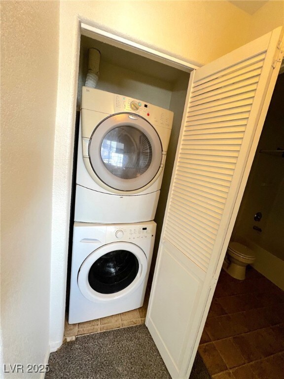 Clothes washing area with stacked washing maching