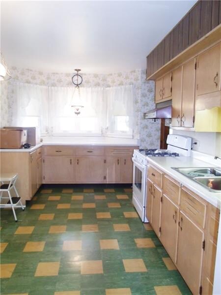 Kitchen offering plenty of cabinets and room to wo