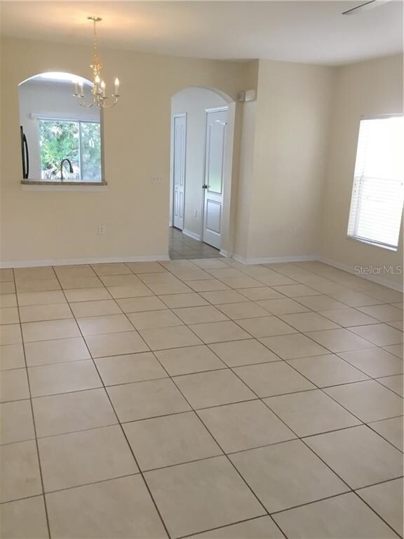 Main living room room. Tile throughout the unit, e