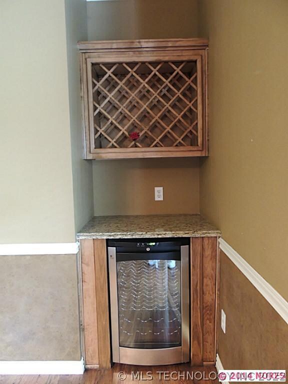 Wine bar with granite counter top in the formal di