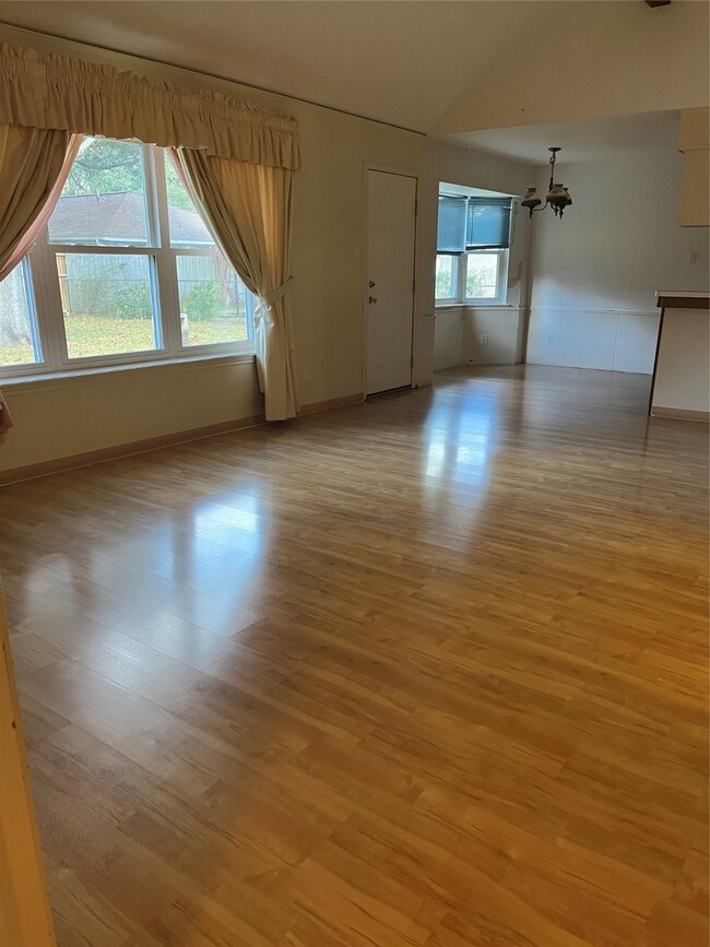 Spacious famiily room with lots of windows for natural light.