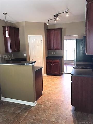 View from the dining area of the eat in kitchen to the dining room.