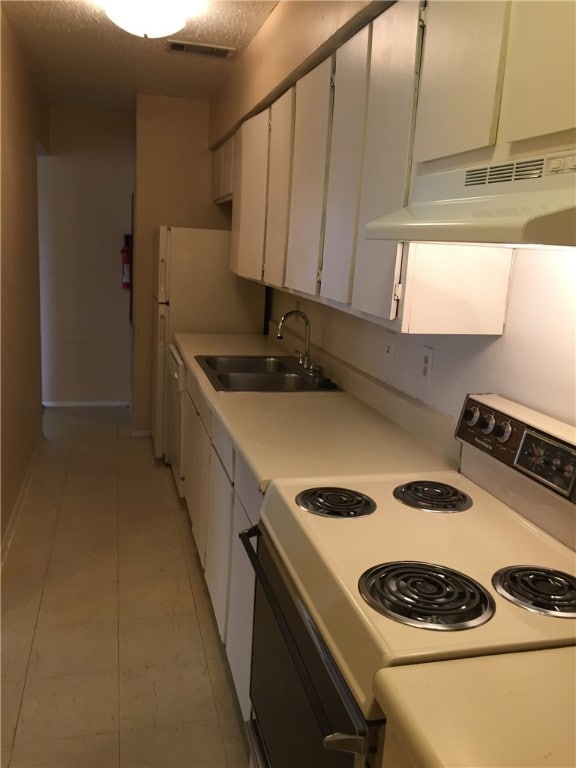 Kitchen with visible vents, under cabinet range ho