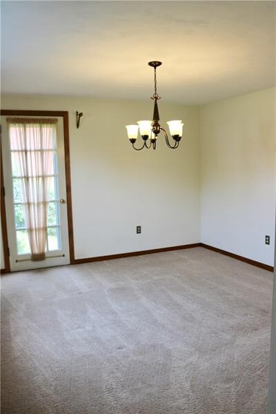 Dining room, side door leads to the side yard and 