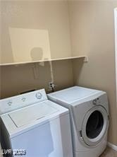 Clothes washing area featuring laundry area, baseb