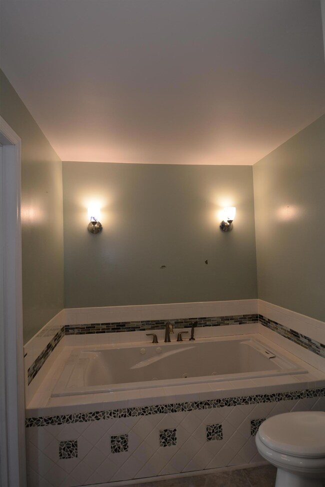 The soaker tub is a lovely place to relax after a long day.