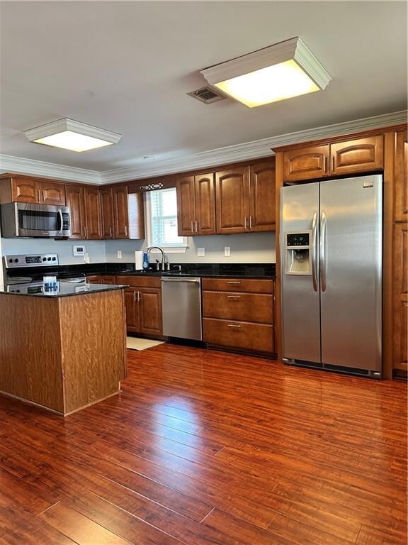 Open kitchen with stainless appliances
