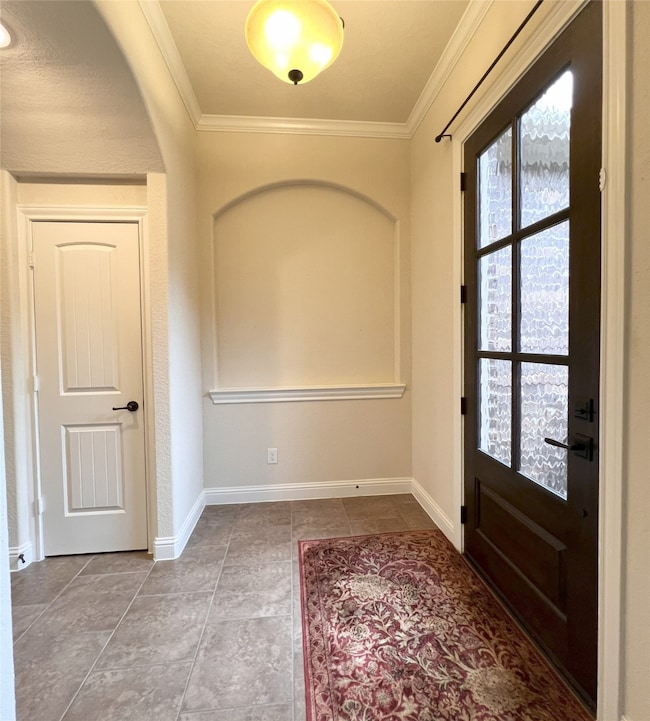 ENTRY WAY FEATURES GLASS FRONT DOOR, TILE FOYER AN