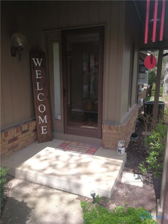 Private entry, driveway & patio.