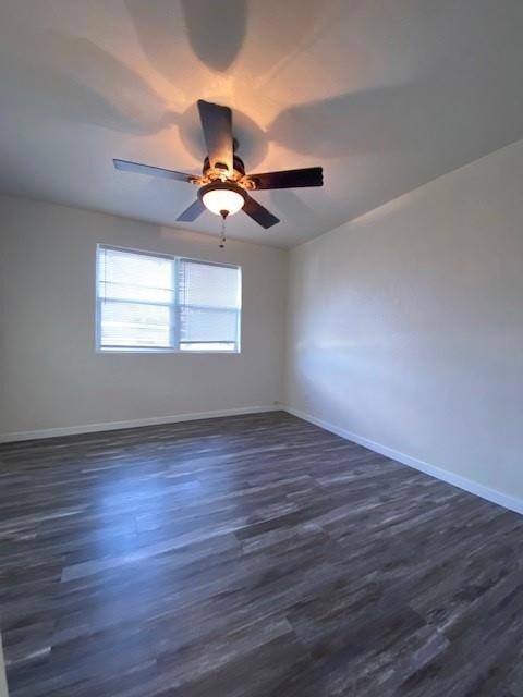 Bedroom featuring dark wood-type flooring and a ceiling fan
