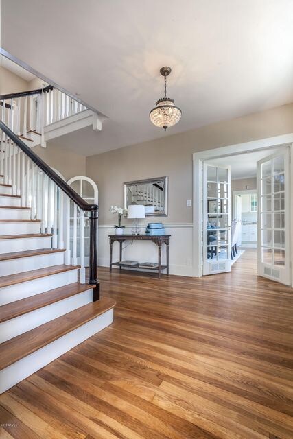 Foyer with original hardwood