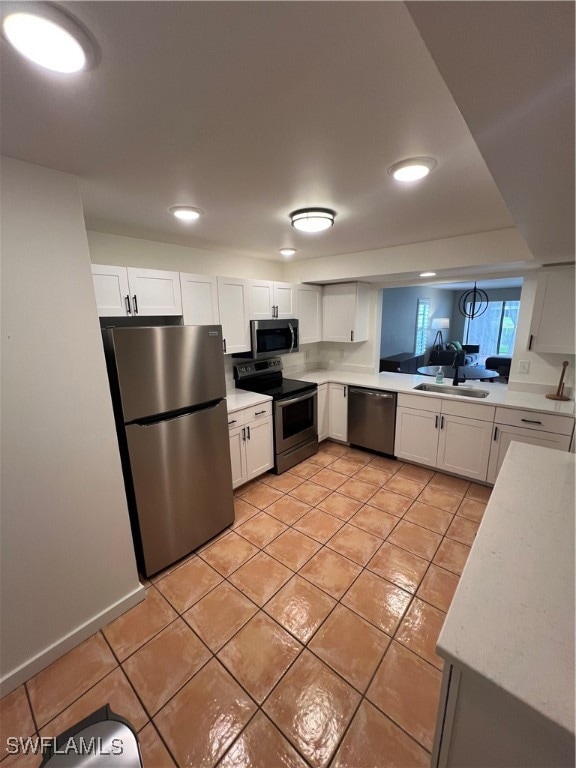 Kitchen featuring dishwashing machine, white cabin
