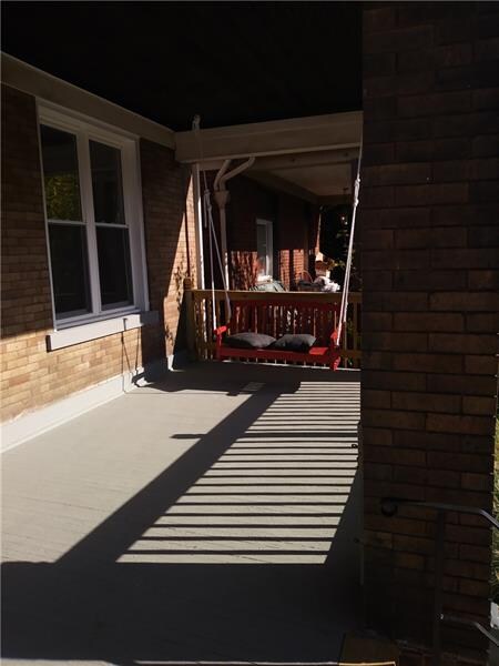 Front porch with swing for relaxing & people watch