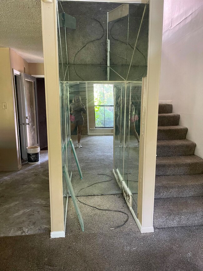 Stairs with a textured ceiling