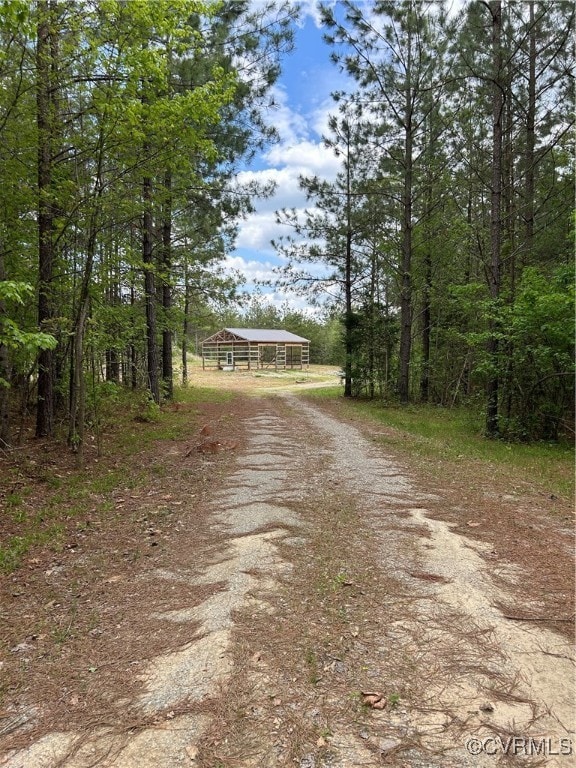 View of street with dirt driveway