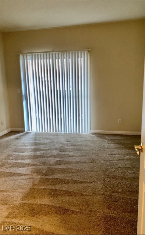 Empty room featuring plenty of natural light and b