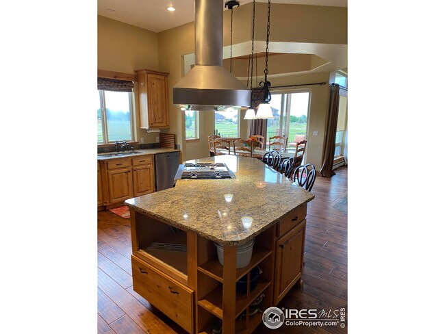 This custom angled island goes on FOREVER!!  So much great storage,  walk-pantry and extra deep sinks!