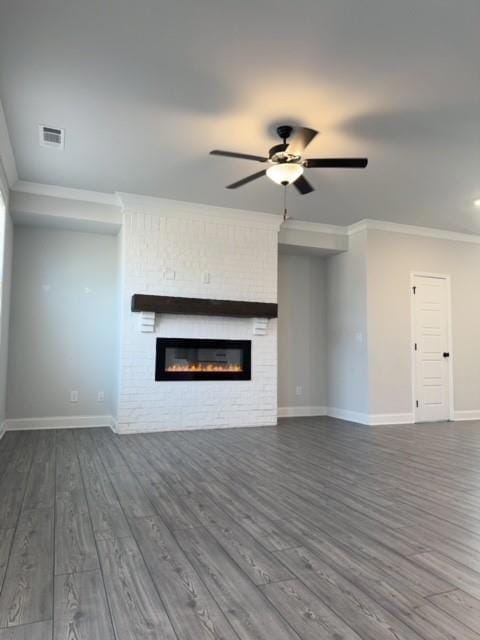Unfurnished living room featuring dark wood-type f