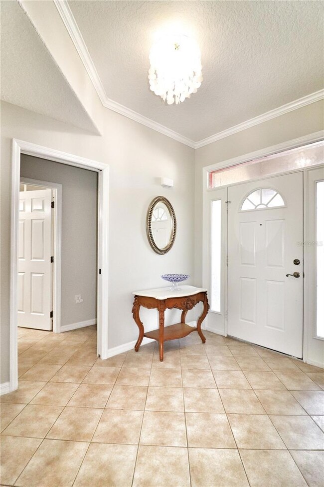 crown molding and solid surface flooring throughout