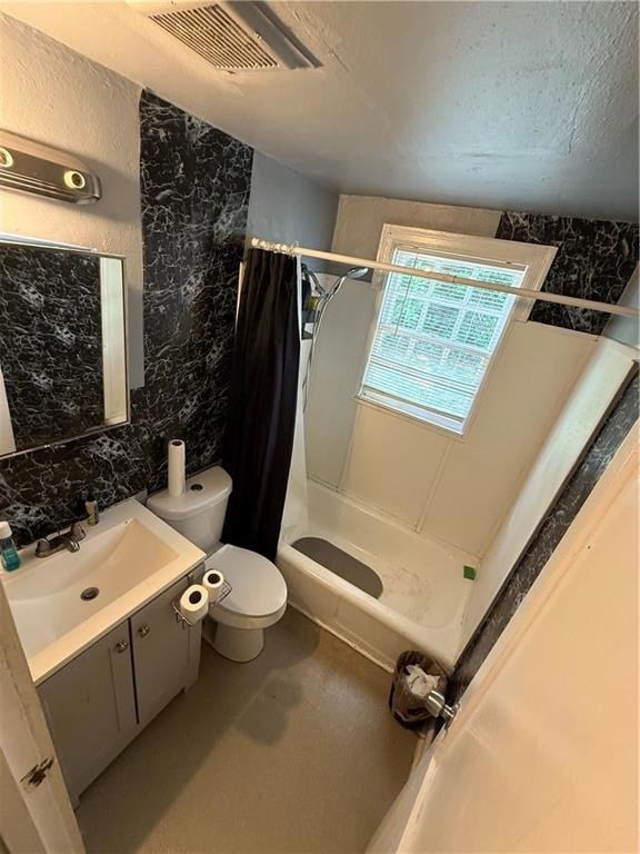 Full bathroom featuring a stall shower, toilet, vanity, and finished concrete floors