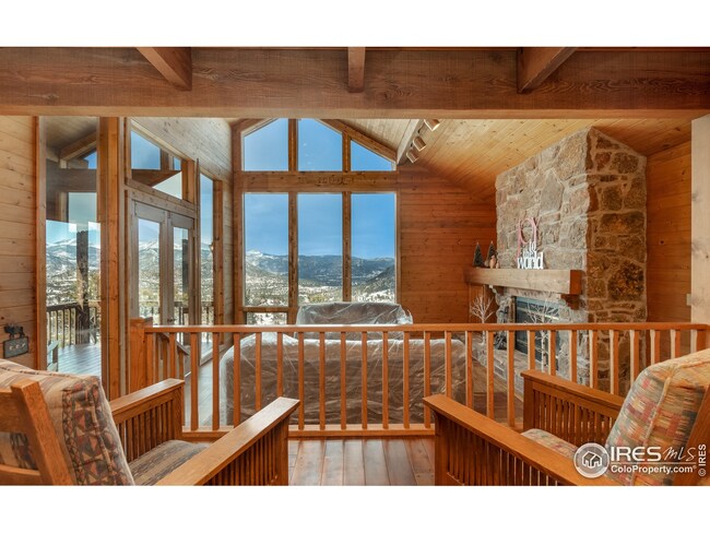 Floor to ceiling windows frame the mountain views