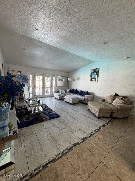 Living room featuring french doors, lofted ceiling