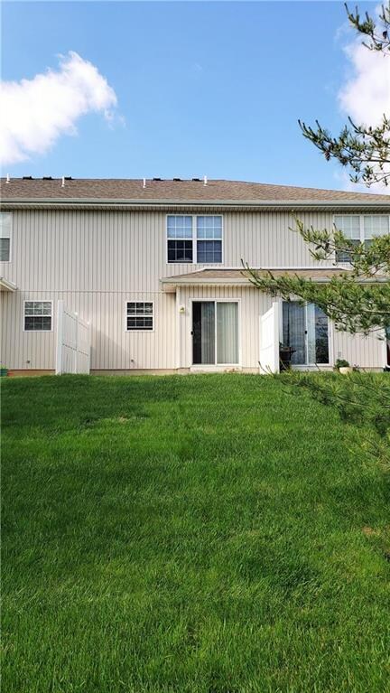 Back yard and patio with slider door into dining a