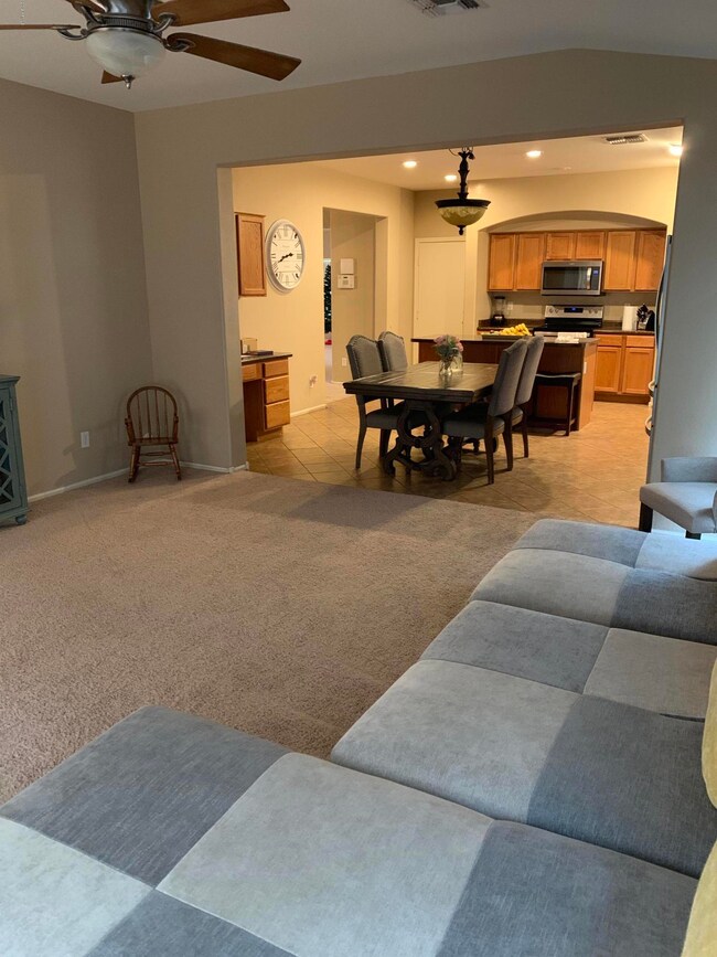 living room opens to dining