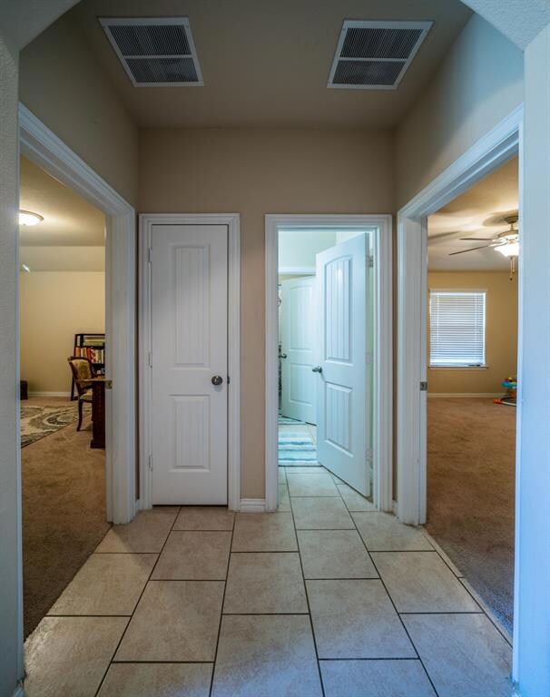 Two bedrooms off to the front of the home with a f