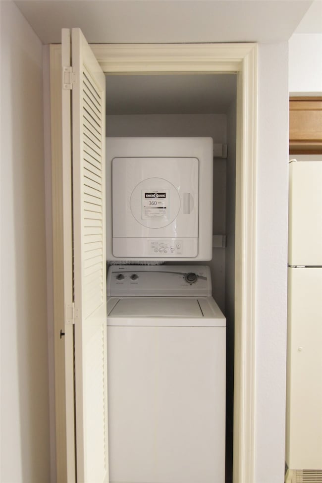 utility closet with kitchen to the right