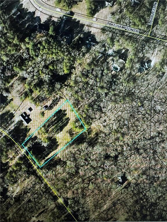 Aerial overview of property's location featuring property boundaries highlighted