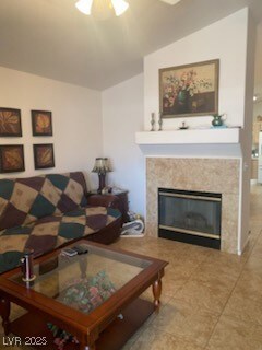Living room featuring vaulted ceiling, a premium f