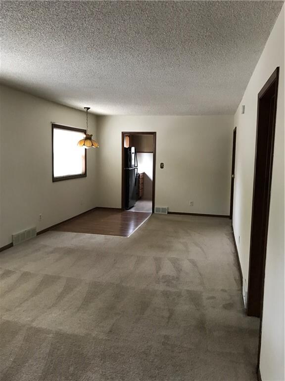 Living Room/Dining Room leads into the kitchen.  T