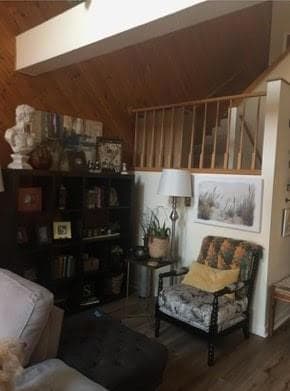 Sitting room with wooden walls and wood finished f