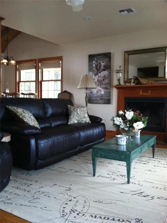 Settle into this inviting living area that looks out to water