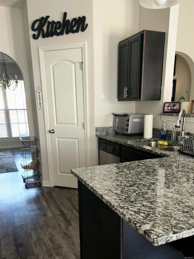 This side of the kitchen includes big pantry and b