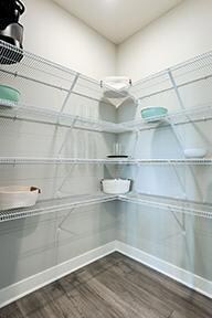 Your spacious walk-in pantry awaits storage for large appliances, staple items, and more! *Photo of model home some colors and selections my vary.